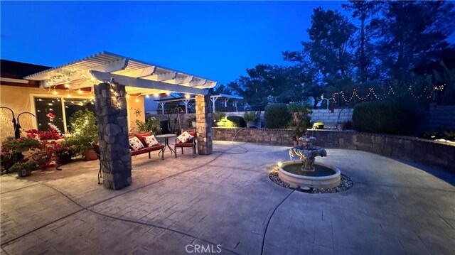 27568 Linda Vista Rd, Barstow, CA 92311 - patio at twilight featuring a patio area and a pergola