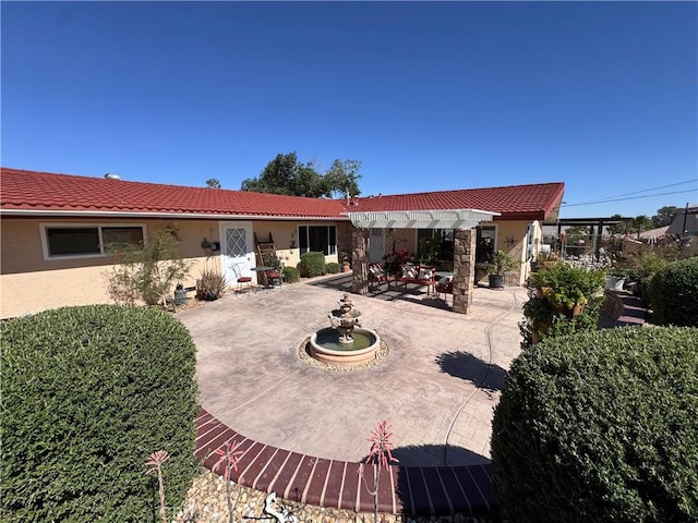 27568 Linda Vista Rd, Barstow, CA 92311 - rear view of house with a patio, stucco siding, a tile roof, and a pergola