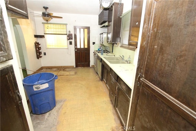 5571 Noble St, Riverside, CA 92503 - kitchen featuring a sink, light flooring, a ceiling fan, dark brown cabinets, and light countertops