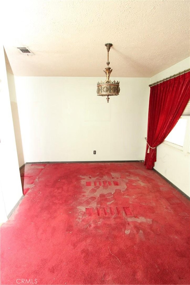 5571 Noble St, Riverside, CA 92503 - unfurnished room featuring carpet and a textured ceiling