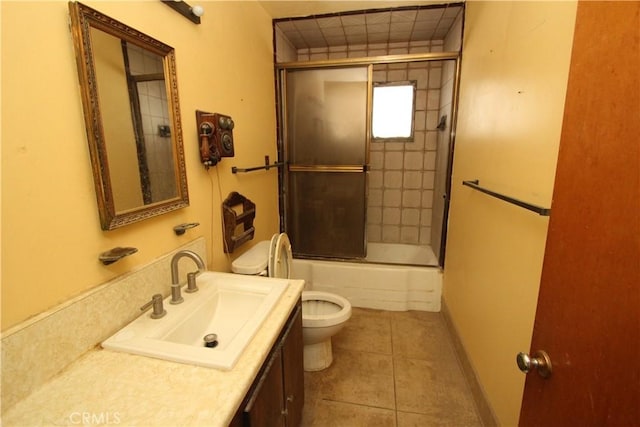 5571 Noble St, Riverside, CA 92503 - bathroom with toilet, vanity, tile patterned flooring, and shower / bath combination with glass door