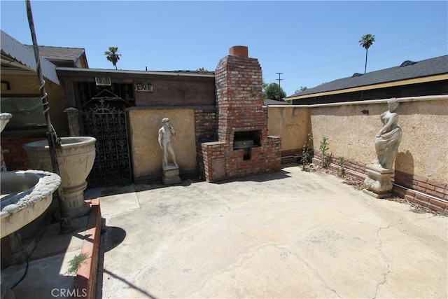 5571 Noble St, Riverside, CA 92503 - view of patio / terrace with a fireplace