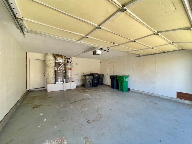 1305 Herzel Ave, Lancaster, CA 93535 - garage with a garage door opener and secured water heater