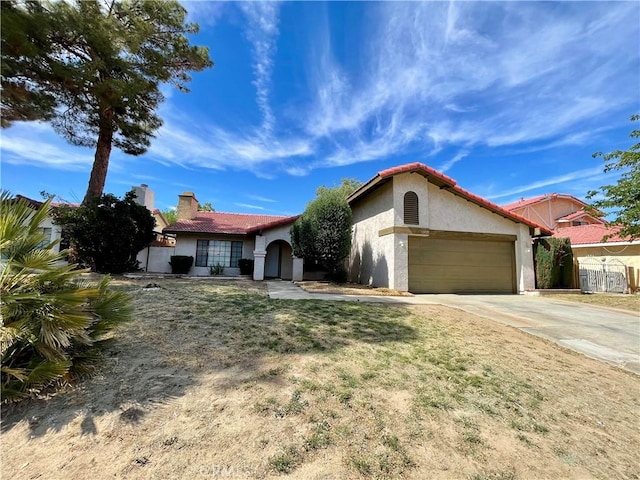 1305 Herzel Ave, Lancaster, CA 93535 - view of front facade featuring stucco siding, an attached garage, concrete driveway, a chimney, and a tile roof