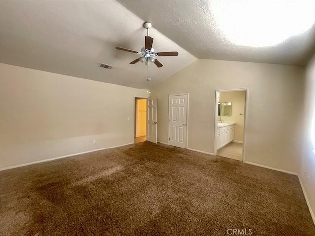 1305 Herzel Ave, Lancaster, CA 93535 - unfurnished bedroom featuring vaulted ceiling, baseboards, carpet, ensuite bathroom, and ceiling fan