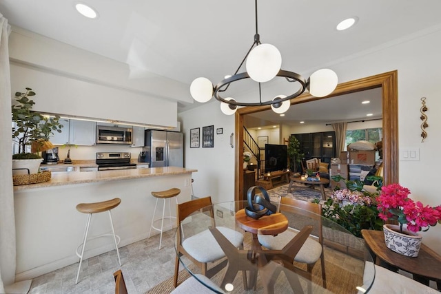 7930 Mission Center Ct Unit F, San Diego, CA 92108 - dining space featuring stairs, light stone finish flooring, and recessed lighting