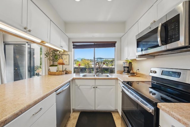 7930 Mission Center Ct Unit F, San Diego, CA 92108 - kitchen with appliances with stainless steel finishes, a sink, white cabinetry, light countertops, and recessed lighting