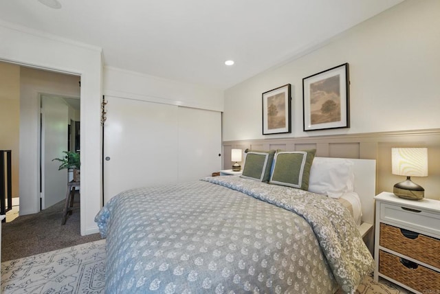 7930 Mission Center Ct Unit F, San Diego, CA 92108 - bedroom with a closet, carpet flooring, a wainscoted wall, a decorative wall, and recessed lighting