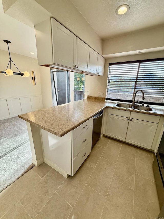 7930 Mission Center Ct Unit F, San Diego, CA 92108 - kitchen with stainless steel dishwasher, a textured ceiling, white cabinets, a peninsula, and recessed lighting