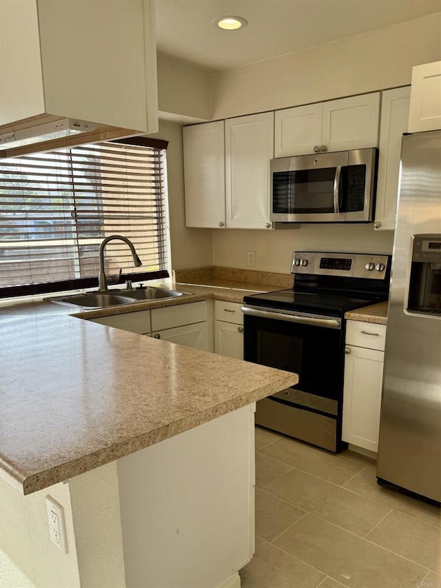 7930 Mission Center Ct Unit F, San Diego, CA 92108 - kitchen with appliances with stainless steel finishes, white cabinetry, plenty of natural light, and recessed lighting