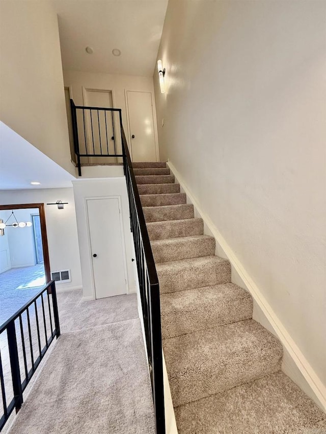 7930 Mission Center Ct Unit F, San Diego, CA 92108 - stairway featuring carpet flooring and baseboards