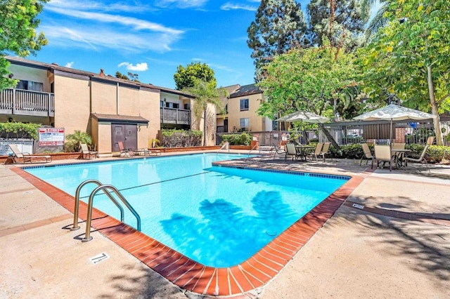 7930 Mission Center Ct Unit F, San Diego, CA 92108 - community pool featuring a patio area and a residential view