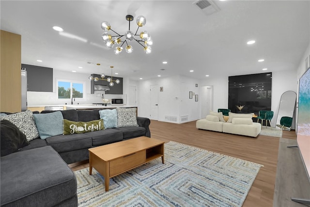 5548 Irondale Ave, Los Angeles, CA 91367 - living area with a chandelier, recessed lighting, and light wood-style floors