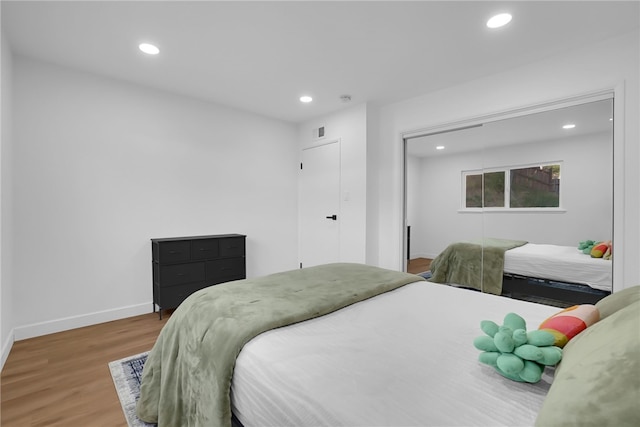 5548 Irondale Ave, Los Angeles, CA 91367 - bedroom featuring recessed lighting, wood finished floors, baseboards, and a closet