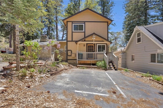 33079 Ridge Rd, Arrowbear, CA 92382 - view of front of house featuring a wooden deck and a chimney