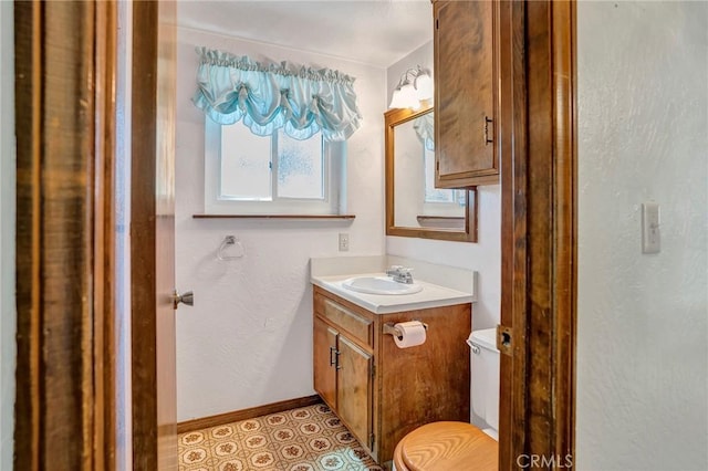 33079 Ridge Rd, Arrowbear, CA 92382 - half bathroom with vanity, toilet, baseboards, and a textured wall