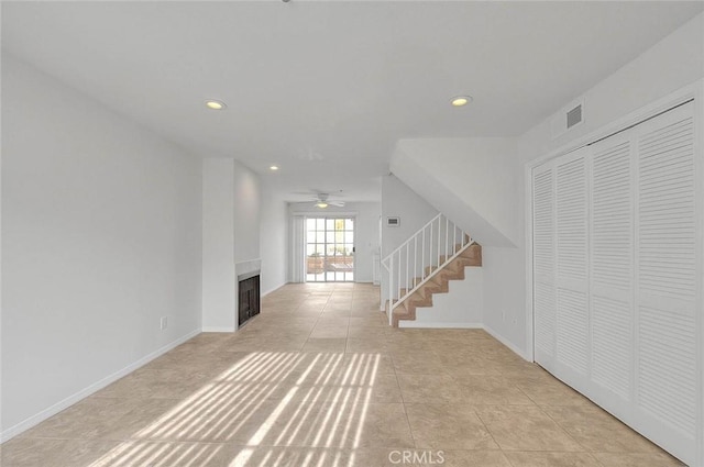 4315 W 145th St Unit 10, Lawndale, CA 90260 - unfurnished living room with stairway, recessed lighting, ceiling fan, light tile patterned flooring, and a fireplace