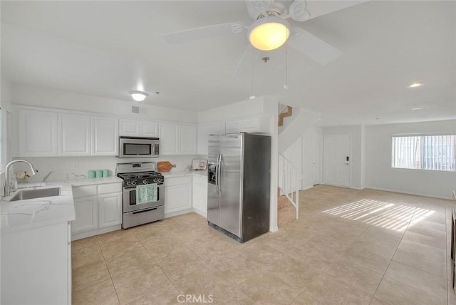 4315 W 145th St Unit 10, Lawndale, CA 90260 - kitchen featuring appliances with stainless steel finishes, a sink, light tile patterned flooring, white cabinets, and recessed lighting