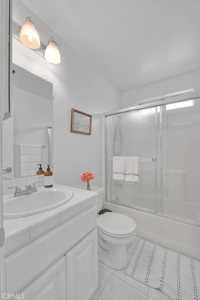 4315 W 145th St Unit 10, Lawndale, CA 90260 - full bathroom featuring vanity, toilet, bath / shower combo with glass door, and tile patterned floors