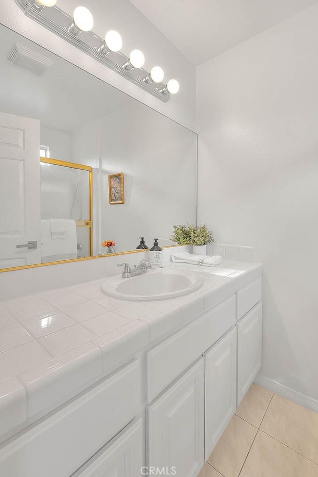 4315 W 145th St Unit 10, Lawndale, CA 90260 - full bath featuring vanity, tile patterned flooring, an enclosed shower, and baseboards