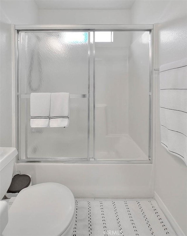 4315 W 145th St Unit 10, Lawndale, CA 90260 - full bathroom featuring toilet, enclosed tub / shower combo, and tile patterned floors