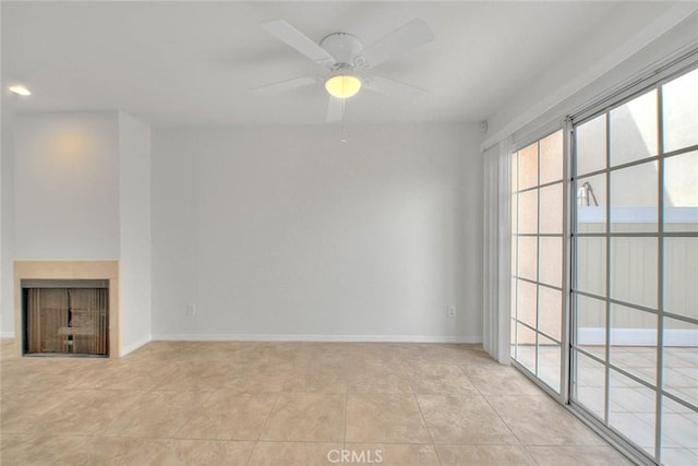 4315 W 145th St Unit 10, Lawndale, CA 90260 - unfurnished living room with a fireplace, a ceiling fan, light tile patterned floors, and baseboards