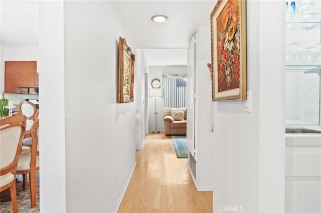 11952 Darlington Ave Unit 6, Los Angeles, CA 90049 - corridor featuring light wood-type flooring and baseboards