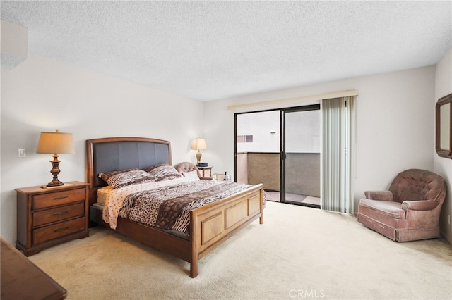 11952 Darlington Ave Unit 6, Los Angeles, CA 90049 - bedroom with access to exterior, light colored carpet, and a textured ceiling