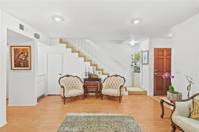 11952 Darlington Ave Unit 6, Los Angeles, CA 90049 - sitting room featuring stairs and light wood-type flooring