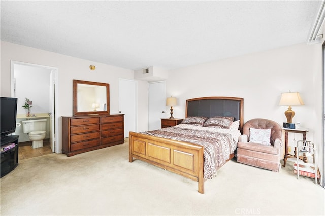 11952 Darlington Ave Unit 6, Los Angeles, CA 90049 - bedroom with light colored carpet and ensuite bath