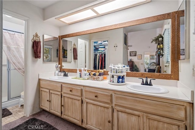 44044 11th St E, Lancaster, CA 93535 - full bath featuring double vanity, a shower with shower curtain, and toilet