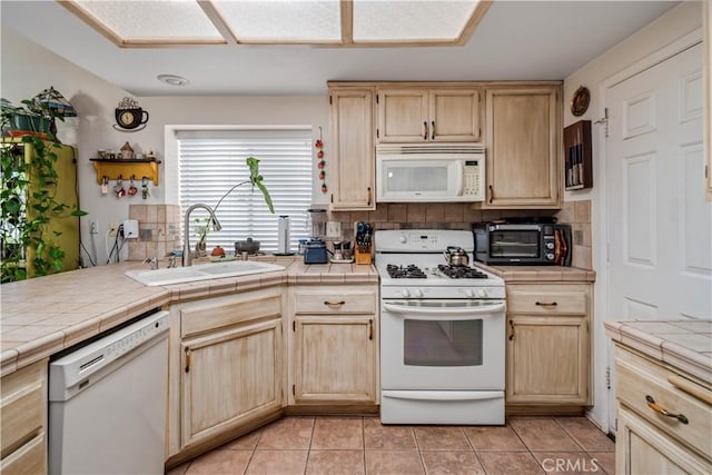 44044 11th St E, Lancaster, CA 93535 - kitchen featuring white appliances, a sink, light brown cabinets, and tile counters
