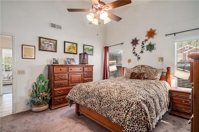 44044 11th St E, Lancaster, CA 93535 - bedroom featuring light colored carpet, access to exterior, a towering ceiling, and a ceiling fan