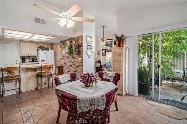 44044 11th St E, Lancaster, CA 93535 - dining area featuring ceiling fan, light tile patterned floors, and vaulted ceiling