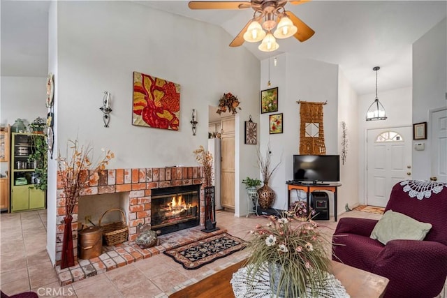 44044 11th St E, Lancaster, CA 93535 - living room featuring a ceiling fan, a fireplace, high vaulted ceiling, and water heater
