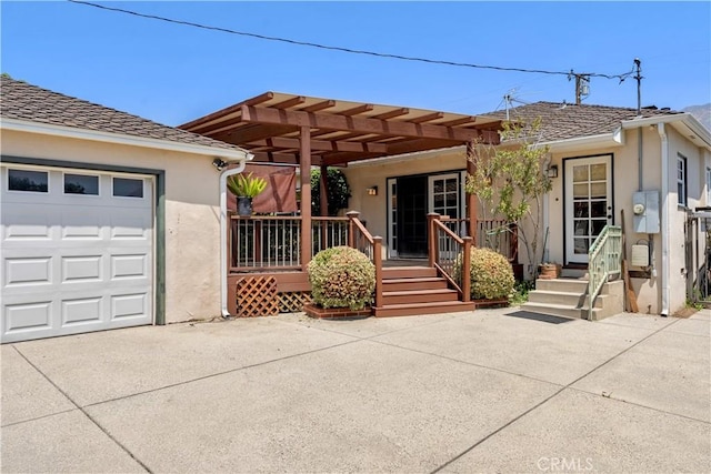 2042 E Crary St, Pasadena, CA 91104 - view of front of property featuring stucco siding, driveway, a pergola, and a garage