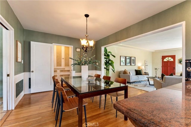 2042 E Crary St, Pasadena, CA 91104 - dining area with light wood-style flooring and a chandelier