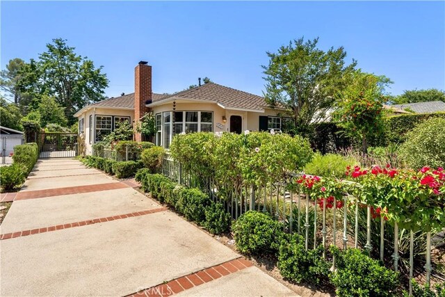 2042 E Crary St, Pasadena, CA 91104 - back of property featuring stucco siding and a chimney