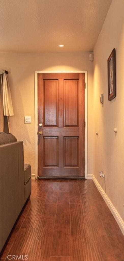 916 E 65th St Unit 3, Inglewood, CA 90302 - entryway featuring baseboards and dark wood-style floors