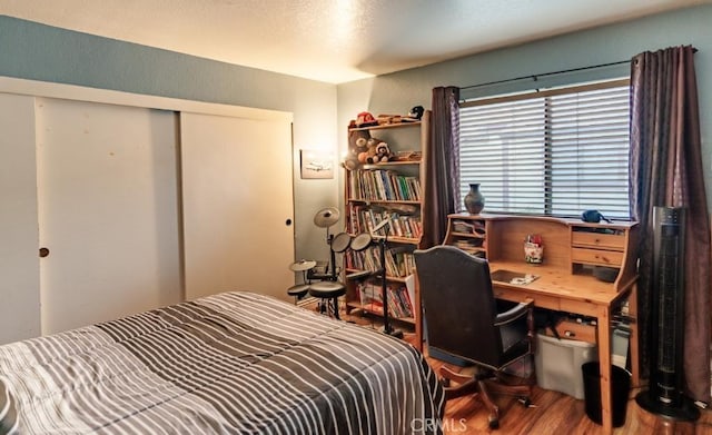 916 E 65th St Unit 3, Inglewood, CA 90302 - bedroom with wood finished floors, a closet, and an office area