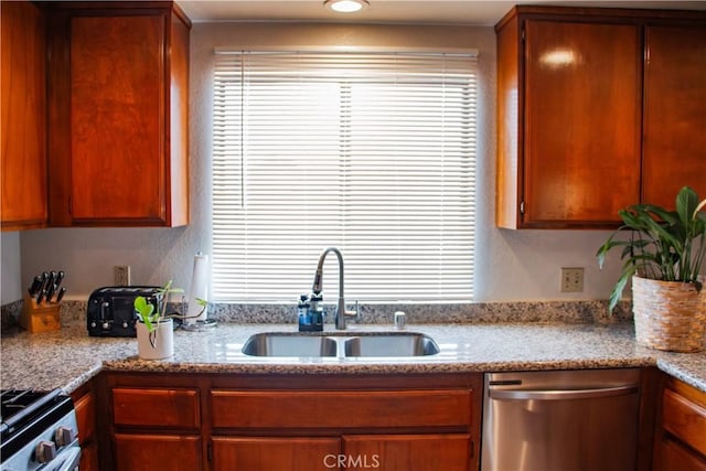 916 E 65th St Unit 3, Inglewood, CA 90302 - kitchen featuring stainless steel appliances, healthy amount of natural light, and light stone countertops