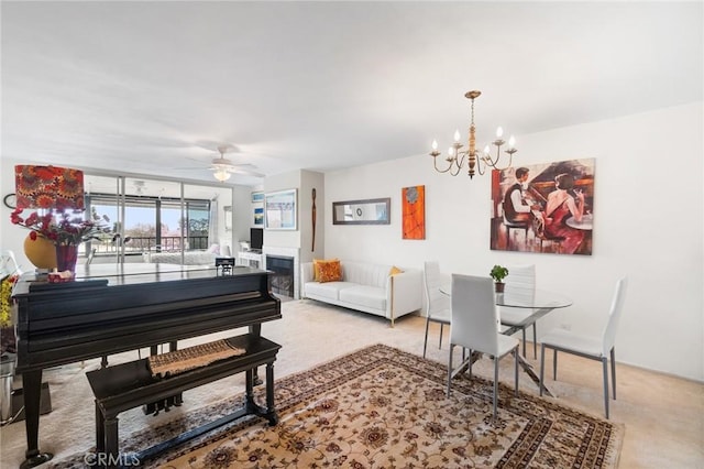 4505 California Ave Unit 506, Long Beach, CA 90807 - dining area featuring a chandelier, carpet flooring, ceiling fan, and a fireplace