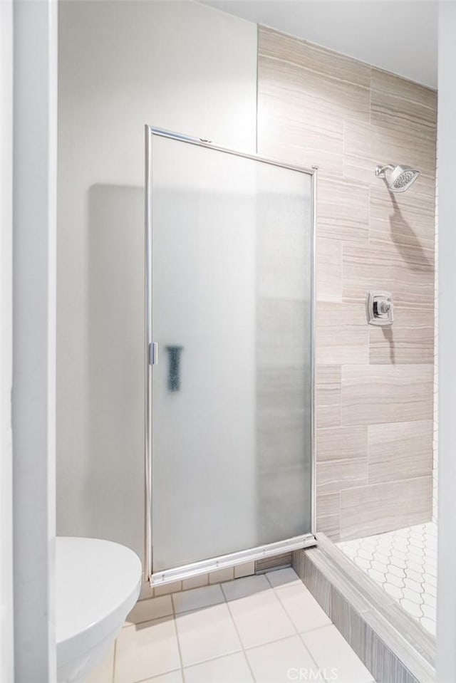 4505 California Ave Unit 506, Long Beach, CA 90807 - full bathroom featuring a stall shower, tile patterned floors, and toilet