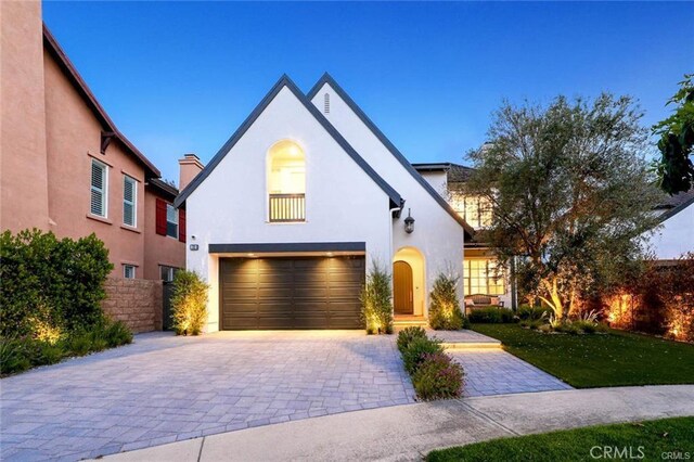 32 Bargemon, Newport Coast, CA 92657 - view of front of house with a garage, decorative driveway, and stucco siding