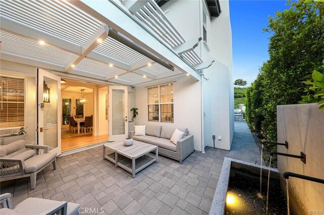 32 Bargemon, Newport Coast, CA 92657 - view of patio with french doors, a pergola, and an outdoor hangout area