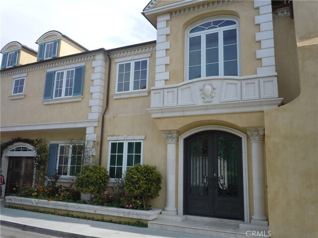59 Rivo Alto Canal, Long Beach, CA 90803 - view of exterior entry with french doors and stucco siding