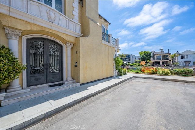 59 Rivo Alto Canal, Long Beach, CA 90803 - entrance to property featuring stucco siding, a residential view, and french doors