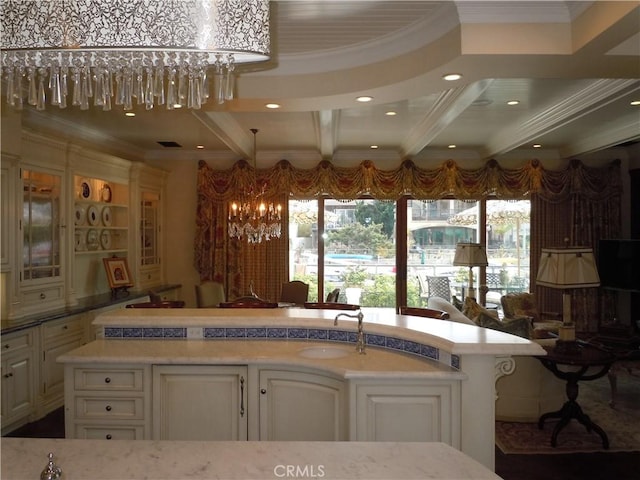 59 Rivo Alto Canal, Long Beach, CA 90803 - kitchen with a sink, beam ceiling, white cabinetry, ornamental molding, and light stone counters
