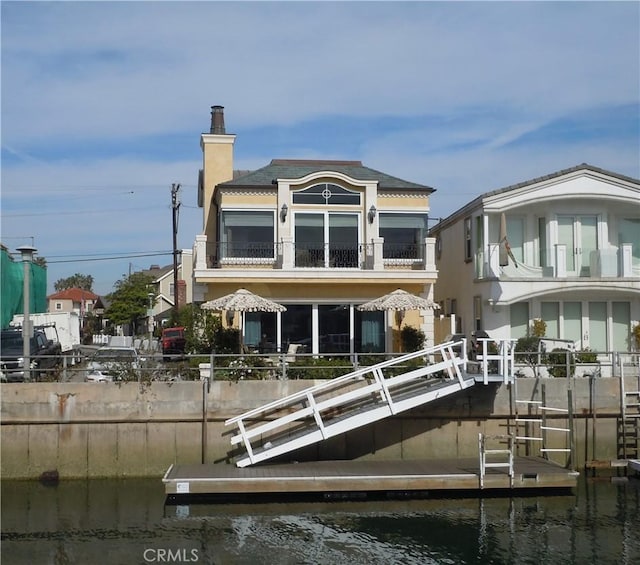59 Rivo Alto Canal, Long Beach, CA 90803 - rear view of house with a balcony, a chimney, and a water view