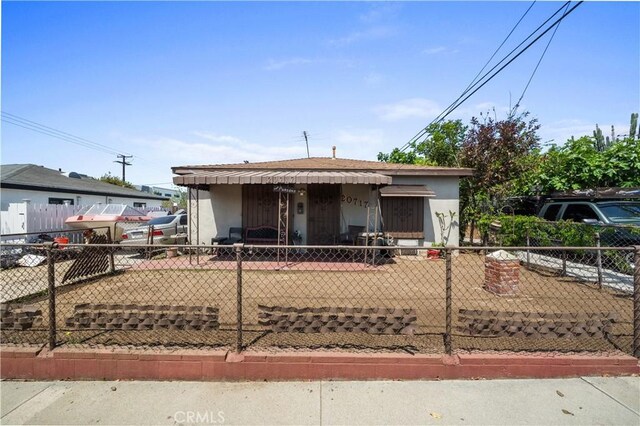 20717 Raymond Ave, Torrance, CA 90502 - bungalow-style house with a fenced front yard and stucco siding